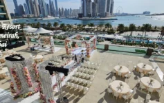 Marriott Resort Palm Jumeirah Dubai beachfront wedding venue with elegant floral decorations and seating
