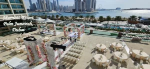 Marriott Resort Palm Jumeirah Dubai beachfront wedding venue with elegant floral decorations and seating