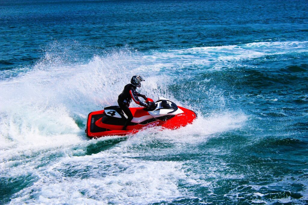 Tourists enjoying thrilling water sports in Bentota Sri Lanka with jet skiing and speed boat ride