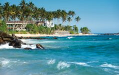Luxury beachfront wedding venue at a destination wedding hotel in Bentota, Sri Lanka with palm trees and ocean view
