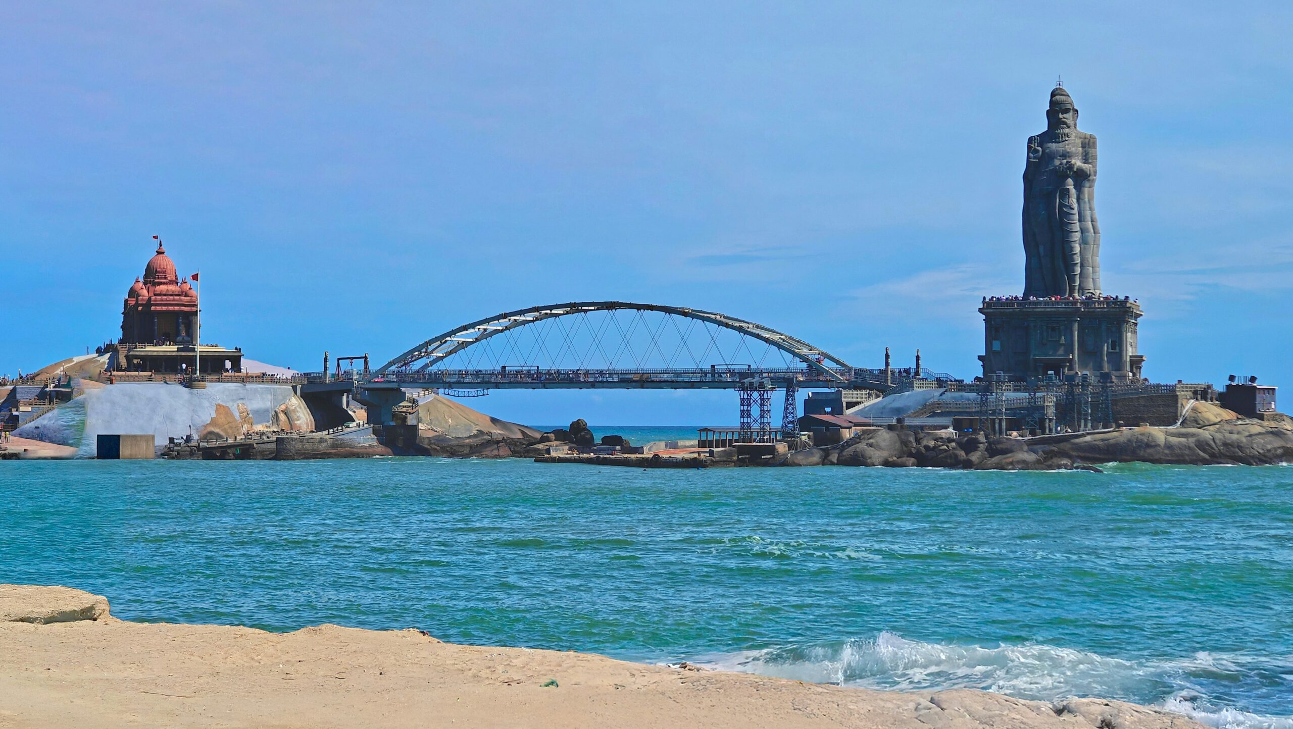 Kanyakumari tourism beach at sunrise with ocean waves and vibrant sky at India’s southernmost tip