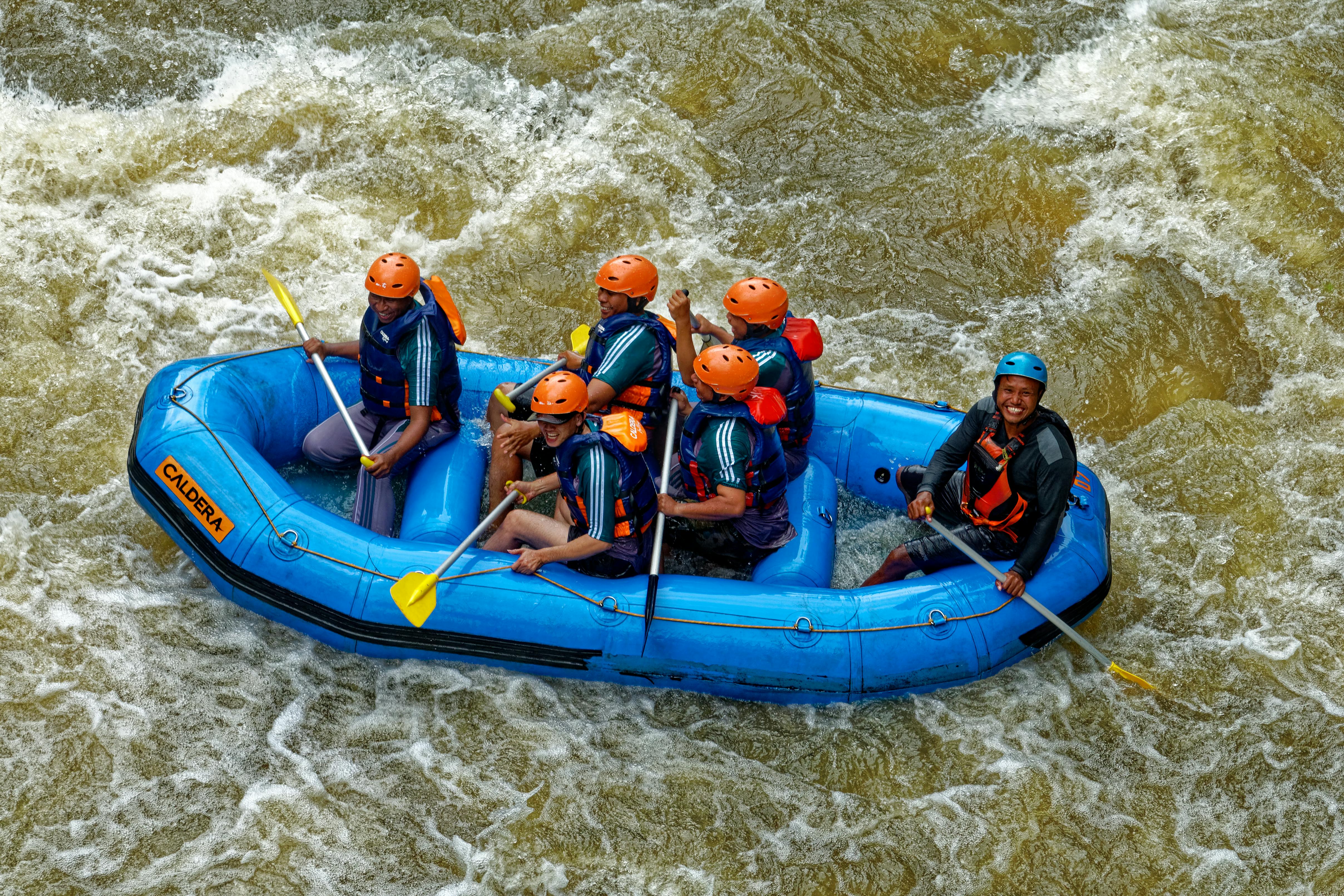 A person jet skiing at full speed on the Bentota River at River Adventure Water Sports Centre in Sri Lanka
