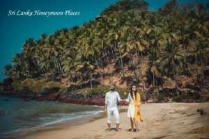 Sri Lanka honeymoon couple walking hand in hand on a tropical beach surrounded by palm trees