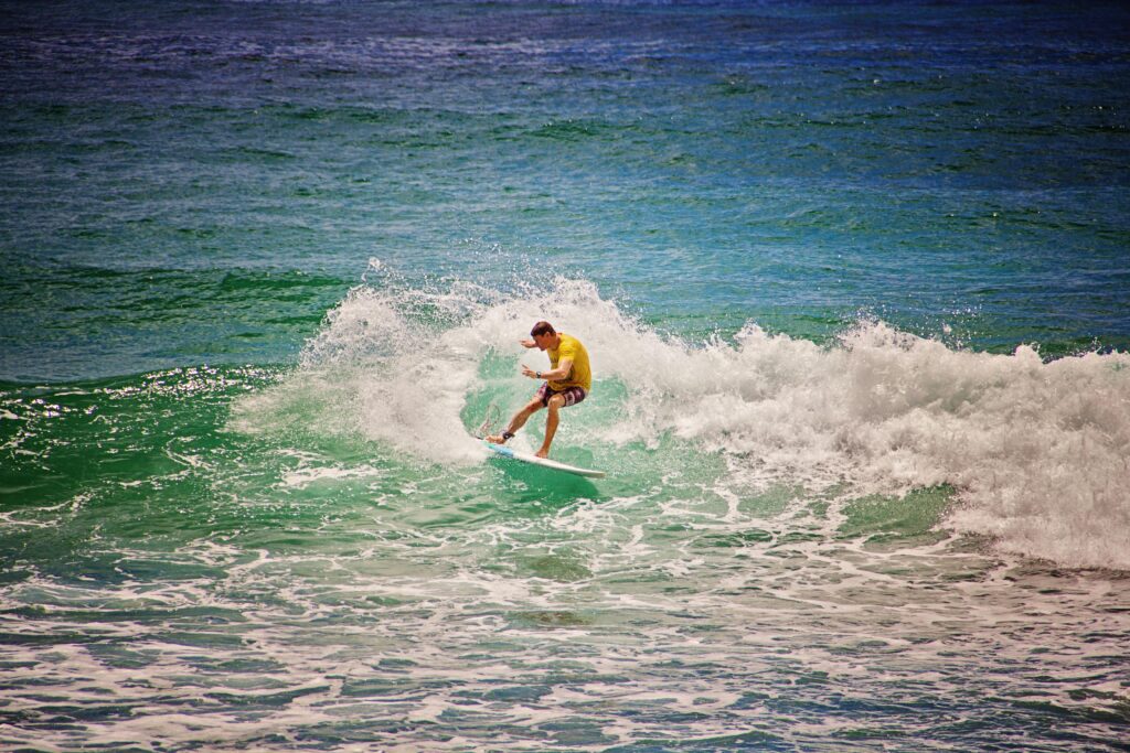 Surfer riding a right-hand point break at Arugam Bay Main Surfing Point, Sri Lanka