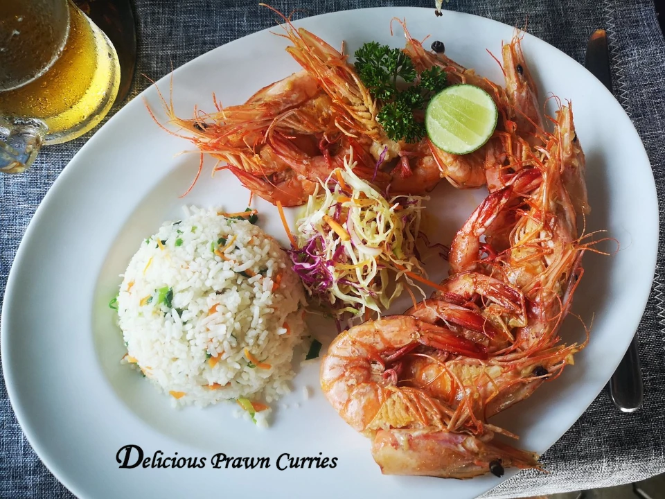 Delicious prawn curry with rice and fresh salad at a vintage restaurant