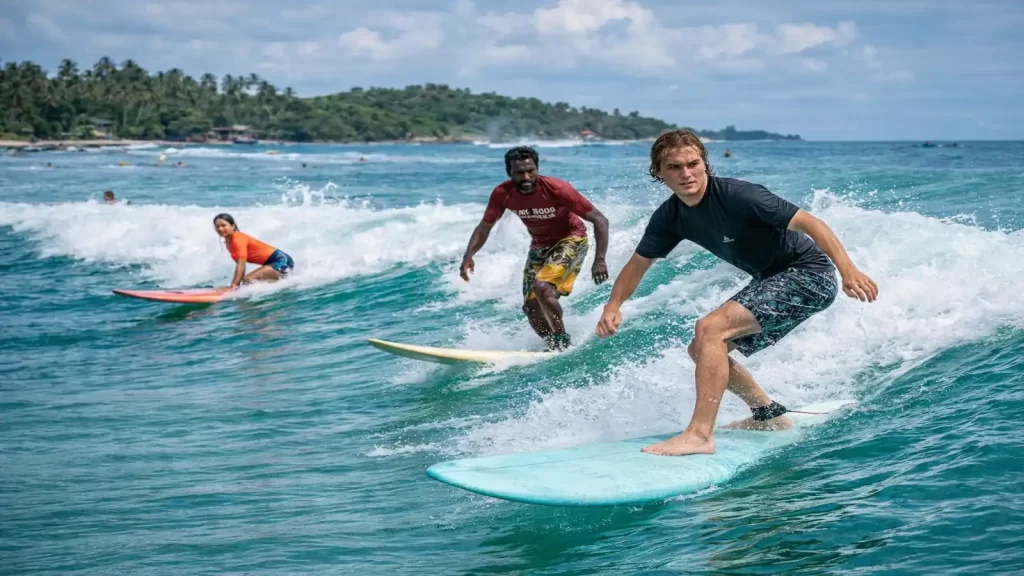 Surfing lessons in Weligama Sri Lanka with surfers riding waves at a surf camp