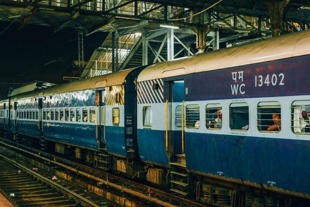Indian passenger train at a station platform in Travel India.