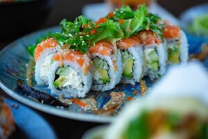 Assortment of popular Japanese foods including sushi, tempura, ramen, and traditional dishes