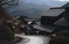 Stone path through traditional houses in a Japanese mountain village