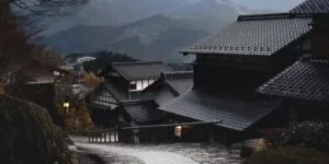 Stone path through traditional houses in a Japanese mountain village