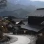 Stone path through traditional houses in a Japanese mountain village