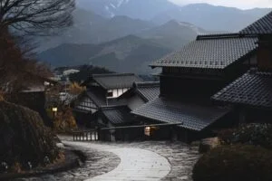 Stone path through traditional houses in a Japanese mountain village