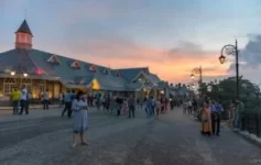 Hill Stations Crowds walking near colonial-style buildings on Shimla Mall Road at sunset