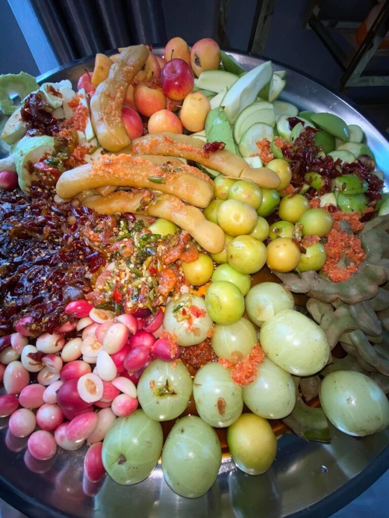 Street food stalls at Marina Beach serving snacks and seafood near the shoreline