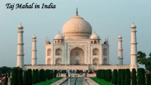 The majestic Taj Mahal in India surrounded by tourists, an essential destination to include when planning your travel itinerary for a historic vacation.