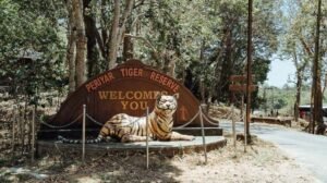 Welcome signboard with a tiger statue at the entrance of Periyar Tiger Reserve, Kerala, India