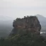 Sigiriya Lion Rock fortress rising above jungle canopy, a UNESCO Heritage Sites in Sri Lanka built by King Kashyapa in the 5th century
