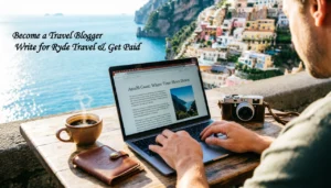 Happy traveller writing a blog on a laptop at a scenic destination become a travel blogger and get paid with Ryde Travel