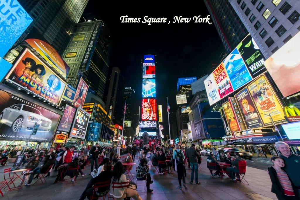 New York City Attraction Times Square illuminated with digital billboards at night in New York City