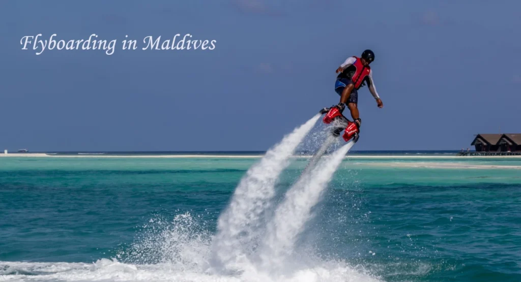 Person flyboarding over crystal-clear turquoise waters in the Maldives