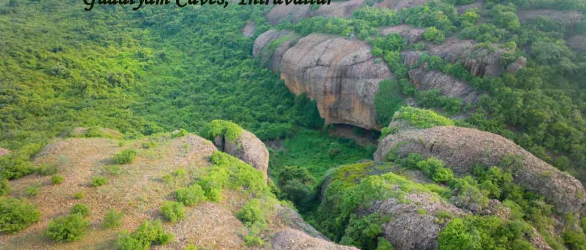 Gudiyam Caves in Tiruvallur surrounded by lush green forest and rocky hills