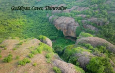 Gudiyam Caves in Tiruvallur surrounded by lush green forest and rocky hills