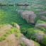 Gudiyam Caves in Tiruvallur surrounded by lush green forest and rocky hills