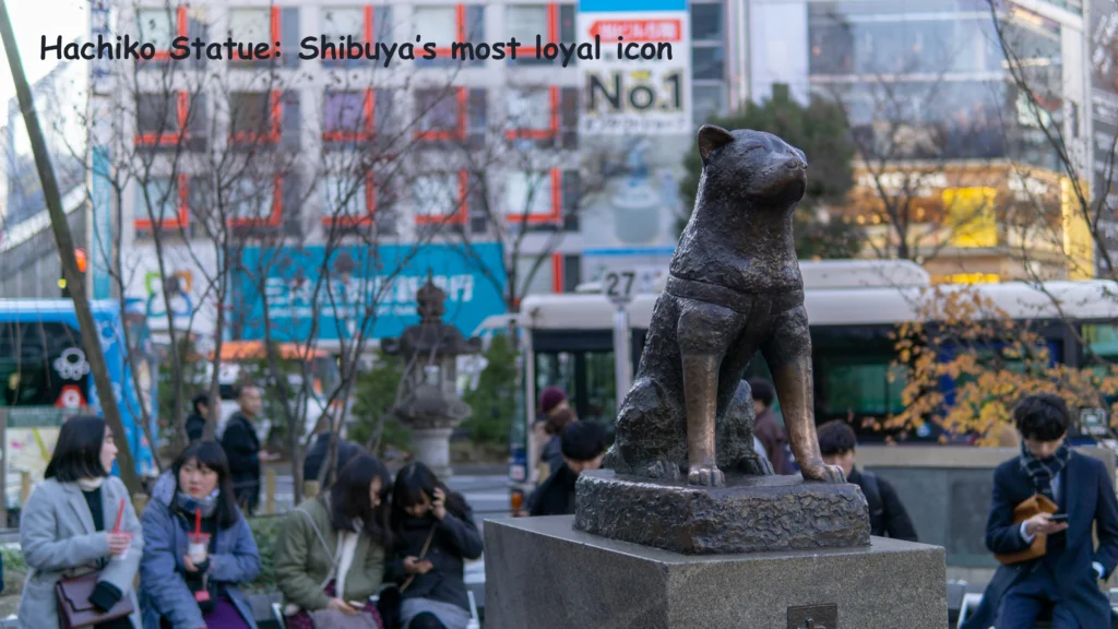Hachiko Statue in Shibuya surrounded by people near Shibuya Station