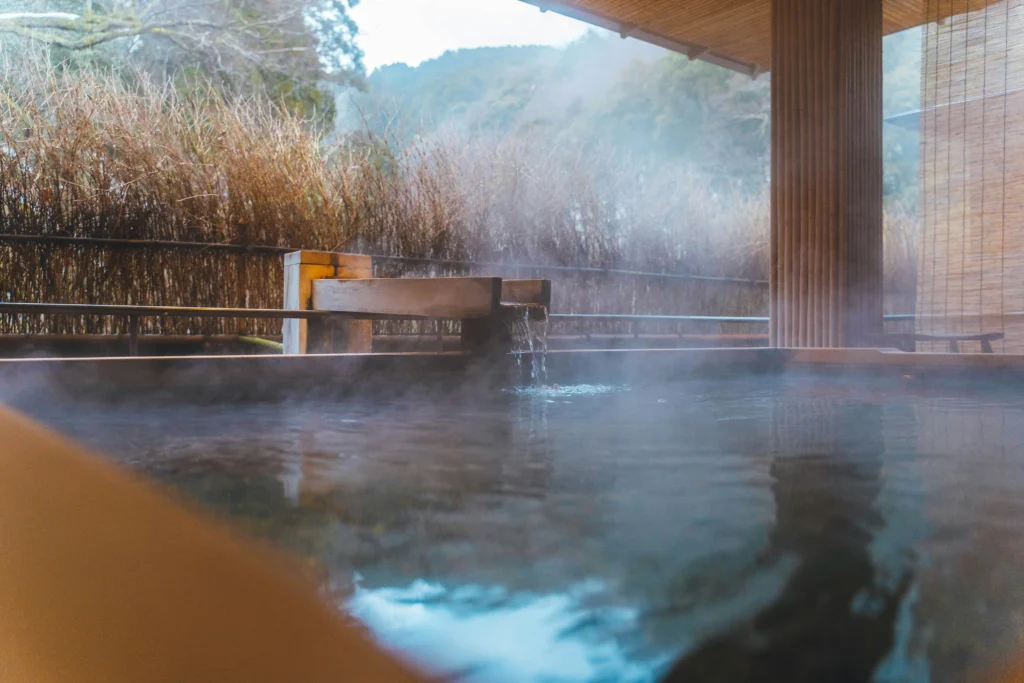 Outdoor onsen hot spring bath with a view of Mount Fuji
