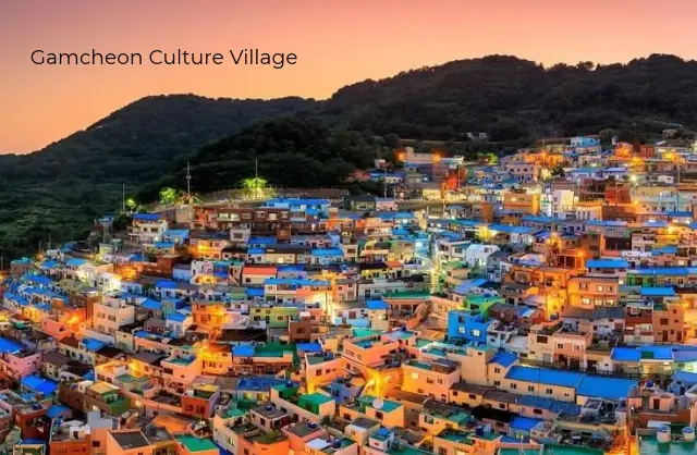 Panoramic view of Gamcheon Culture Village with colorful houses cascading down the hillside in Busan, South Korea.