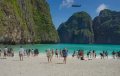 Thailand Tourist Places 2026 featuring a beautiful tropical beach with turquoise water and limestone cliffs