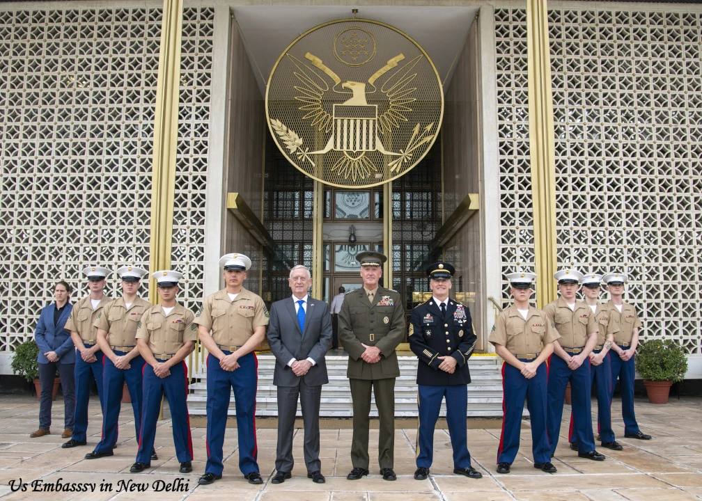 U.S. Embassy in New Delhi, India with U.S. officials and personnel standing at the entrance