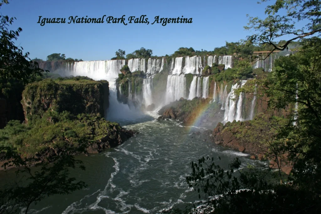 Iguazu National Park waterfalls in Argentina with rainbow and lush forest