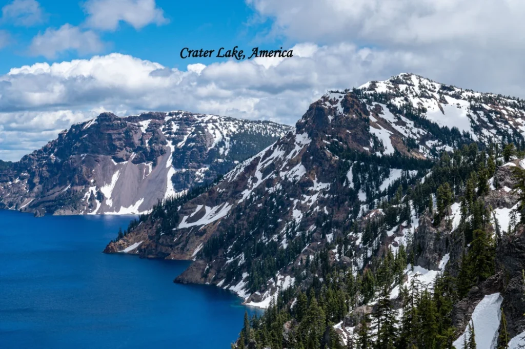 America best lakes, Crater Lake Oregon surrounded by mountains and forest