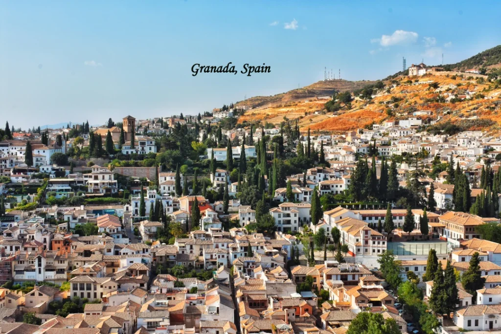 Granada, Spain cityscape with historic architecture and Sierra Nevada mountains