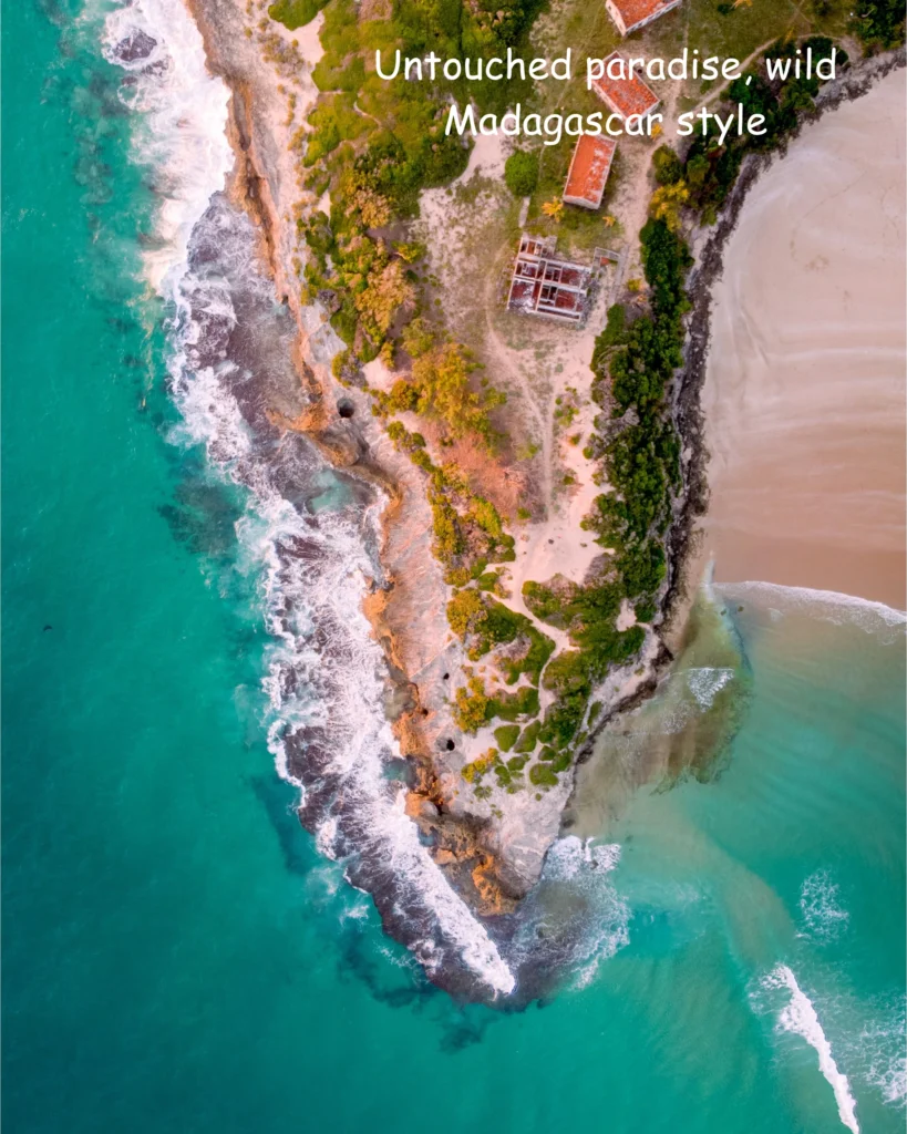 Aerial drone view of Ifaty, Madagascar coastline with turquoise water meeting golden sand