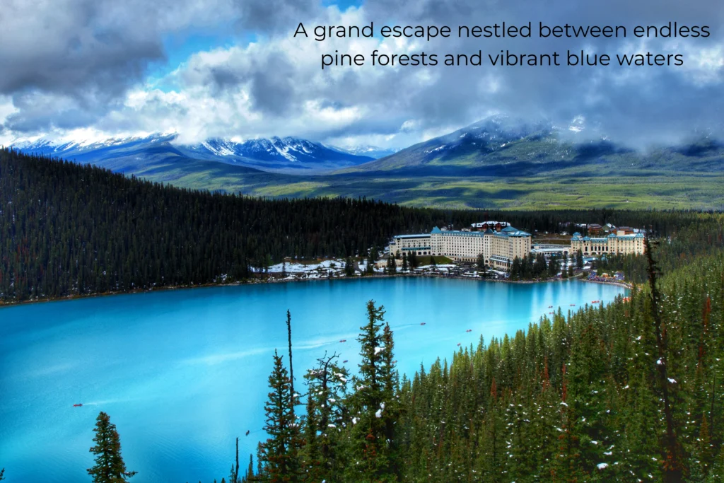 Aerial view of Lake Louise's turquoise water with the Fairmont Chateau Lake Louise nestled among pine forests and snow-capped mountains