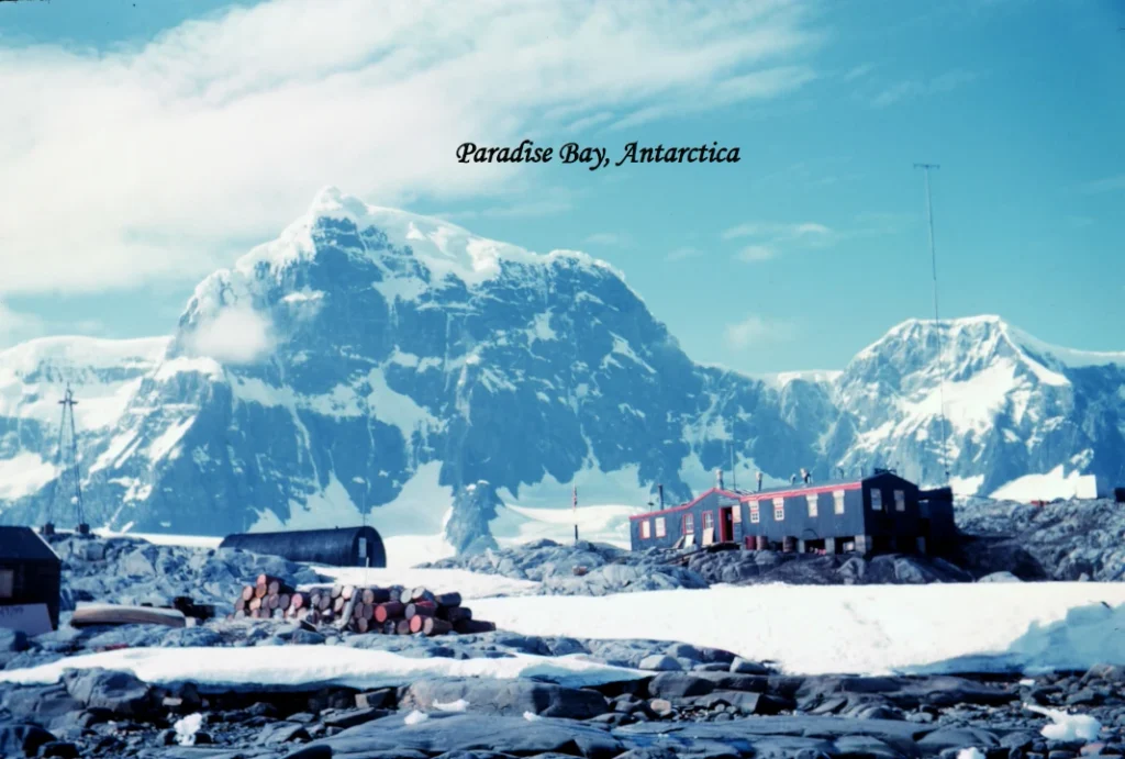 antarctica tourism 2026 Port Lockroy research station surrounded by snowy mountains in Antarctica