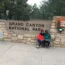 Iconic Grand Canyon National Park entrance sign, surrounded by trees at this famous Arizona natural landmark.